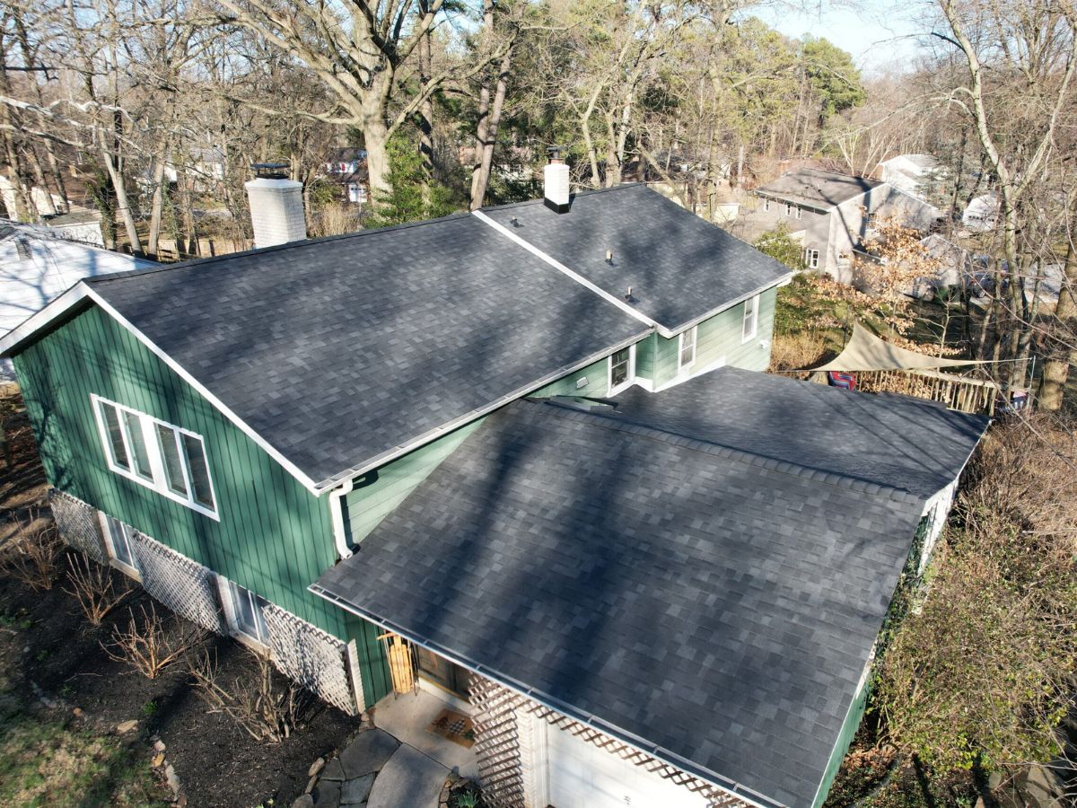Roof replacement in Swarthmore, PA underway on a two-story home with asphalt shingles