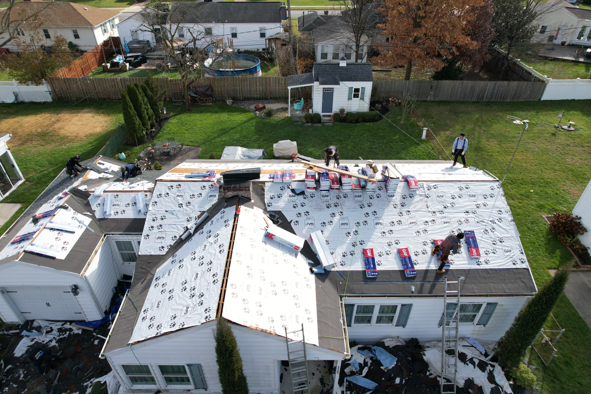 Emergency roofing near me in Port Deposit, MD securing tarp on roof