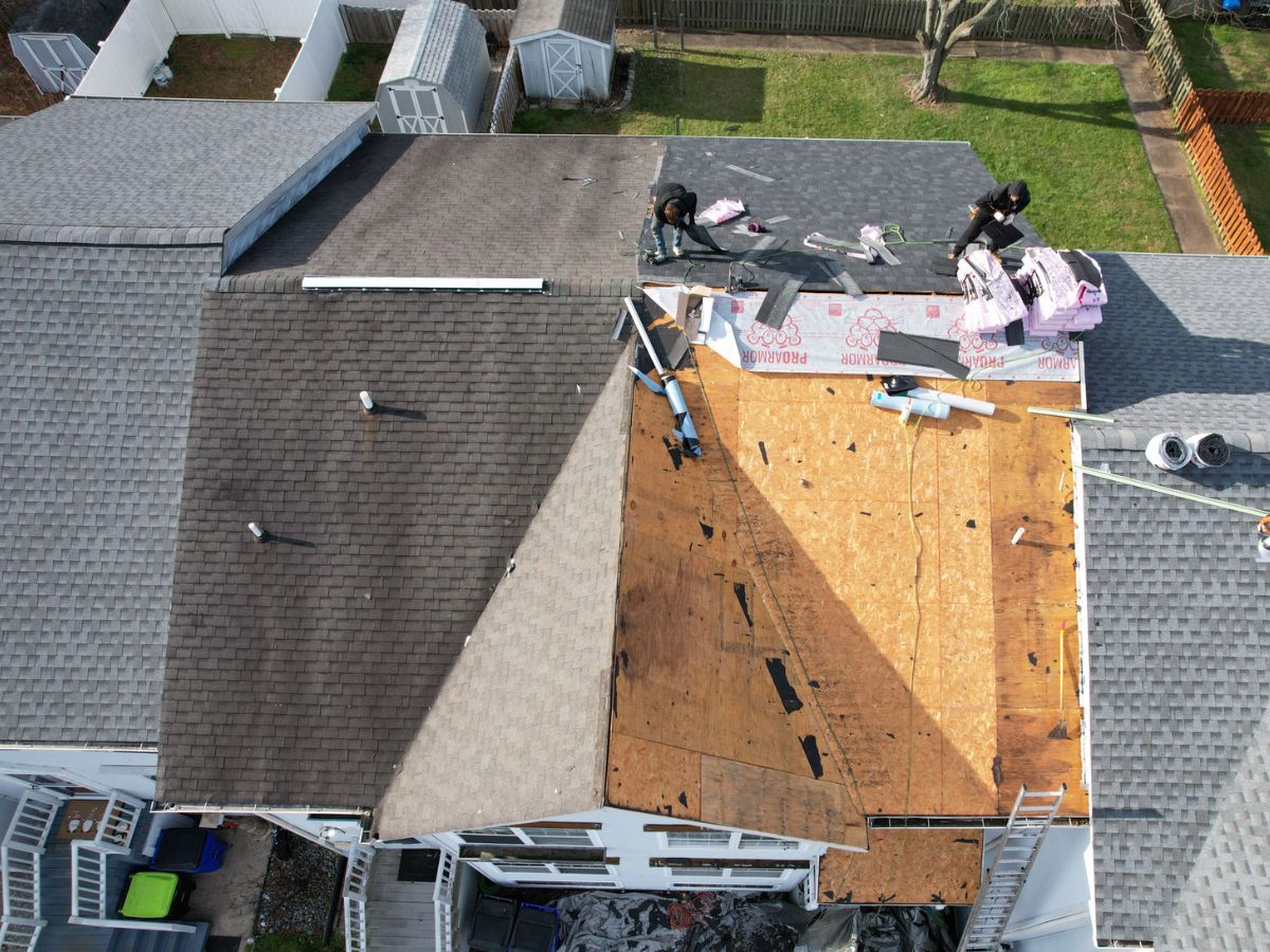 Emergency roofing near me in Drexel Hill, PA applying tarp