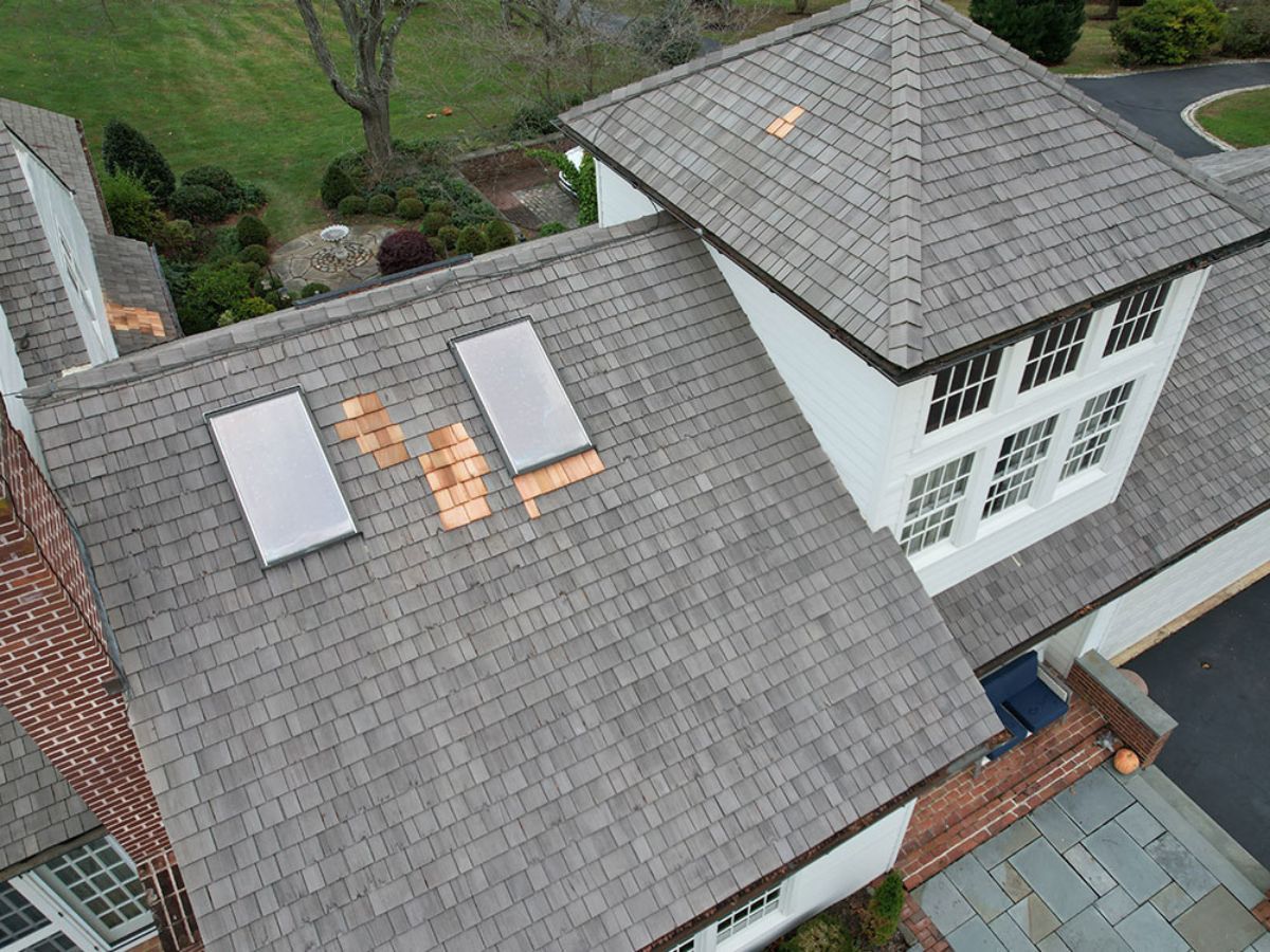 Residential roofing service completed on a West Grove property with varied roof sections