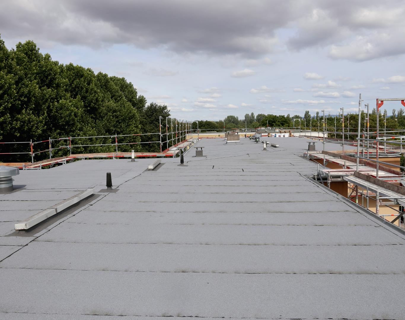 Professional commercial roofing service completed on a New Castle business facility