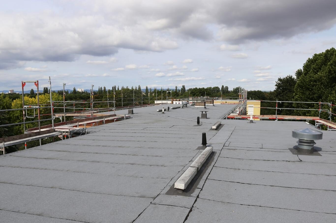 Roofing crew assisting businesses searching commercial roofing near me by Class Roofing
